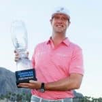 LA QUINTA, CALIFORNIA - JANUARY 23: Hudson Swafford celebrates with the winner's trophy after winning The American Express at the Stadium Course at PGA West on January 23, 2022 in La Quinta, California. (Photo by Steph Chambers/Getty Images)