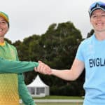 LINCOLN, NEW ZEALAND - MARCH 02: Captains Sune Luus of South Africa and Heather Knight of England (L-R) shake hands prior to the 2022 ICC Women's Cricket World Cup warm up match between South Africa and England at Bert Sutcliffe Oval on March 02, 2022 in Lincoln, New Zealand. (Photo by Kai Schwoerer-ICC/ICC via Getty Images)