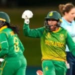South Africa's Trisha Chetty and Shabnim Ismail (R) celebrate the win during 2022 Women's Cricket World Cup match between England and South Africa at Bay Oval in Tauranga on March 14, 2022. (Photo by John COWPLAND / AFP) (Photo by JOHN COWPLAND/AFP via Getty Images)