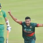 Bangladesh's Taskin Ahmed (R) celebrates after the dismissal of South Africa's Kagiso Rabada (not seen) as South Africa's Keshav Maharaj (L) looks on during the third one-day international (ODI) cricket match between South Africa and Bangladesh at SuperSport Park in Centurion on March 23, 2022. (Photo by Christiaan KOTZE / AFP) (Photo by CHRISTIAAN KOTZE/AFP via Getty Images)
