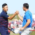 KOHLER, WISCONSIN - SEPTEMBER 24: Collin Morikawa of team United States (L) and Viktor Hovland of Norway and team Europe shake hands during Friday Morning Foursome Matches of the 43rd Ryder Cup at Whistling Straits on September 24, 2021 in Kohler, Wisconsin. (Photo by Andrew Redington/Getty Images)