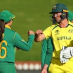 WELLINGTON, NEW ZEALAND - MARCH 22: Meg Lanning of Australia is congratulated by Sune Luus of South Africa after winning the 2022 ICC Women's Cricket World Cup match between South Africa and Australia at Basin Reserve on March 22, 2022 in Wellington, New Zealand. (Photo by Hagen Hopkins-ICC/ICC via Getty Images)