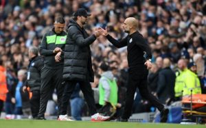 Read more about the article Guardiola relishing title tension between Man City and Liverpool