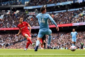 Read more about the article Liverpool hit back twice to earn draw against Manchester City