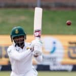 South Africa's Temba Bavuma watches the ball after playing a shot during the first day of the second Test cricket match between South Africa and Bangladesh at St George's Park in Gqeberha on April 8, 2022. (Photo by Marco LONGARI / AFP) (Photo by MARCO LONGARI/AFP via Getty Images)