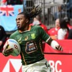 South Africas Darren Adonis scores against Spain during their HSBC World Rugby Sevens Series match in Vancouver, on April 16, 2022. (Photo by Don MacKinnon / AFP) (Photo by DON MACKINNON/AFP via Getty Images)