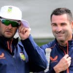 South Africa's cricket captain Dean Elgar (R) talks with his team couch Mark Boucher during a practice session at Hagley Oval in Christchurch on February 15, 2022, ahead of the first Test cricket match between New Zealand and South Africa scheduled to begin on February 17. (Photo by SANKA VIDANAGAMA / AFP) (Photo by SANKA VIDANAGAMA/AFP via Getty Images)