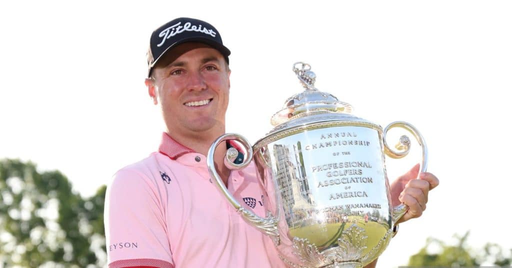 TULSA, OKLAHOMA - MAY 22: Justin Thomas of the United States poses with the Wanamaker Trophy after putting in to win on the 18th green, the third playoff hole during the final round of the 2022 PGA Championship at Southern Hills Country Club on May 22, 2022 in Tulsa, Oklahoma. (Photo by Maddie Meyer/PGA of America/PGA of America via Getty Images )