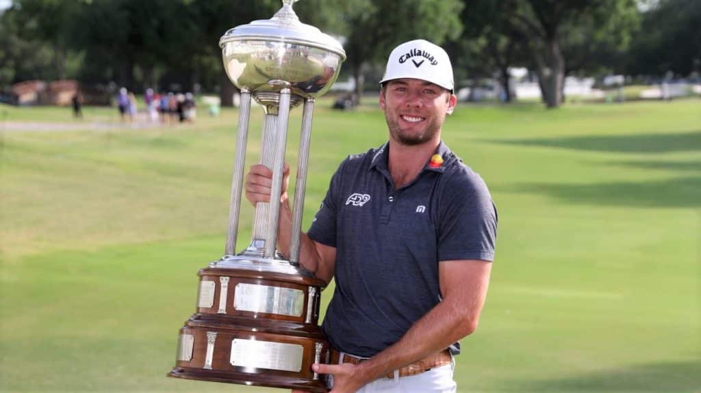 FORT WORTH, TEXAS - MAY 29: Sam Burns of the United States poses with the Leonard Trophy after putting in to win on the 18th green during the first playoff hole during the final round of the Charles Schwab Challenge at Colonial Country Club on May 29, 2022 in Fort Worth, Texas. (Photo by Tom Pennington/Getty Images)