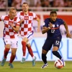 SPLIT, CROATIA - JUNE 06: Christopher Nkunku of France runs with the ball whilst under pressure from Domagoj Vida of Croatia during the UEFA Nations League League A Group 1 match between Croatia and France at Stadion Poljud on June 06, 2022 in Split, Croatia. (Photo by Jurij Kodrun/Getty Images)