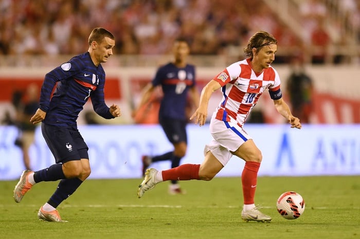 SPLIT, CROATIA - JUNE 06: Luka Modric of Croatia runs with the ball whilst under pressure from Antoine Griezmann of France during the UEFA Nations League League A Group 1 match between Croatia and France at Stadion Poljud on June 06, 2022 in Split, Croatia. (Photo by Jurij Kodrun/Getty Images)