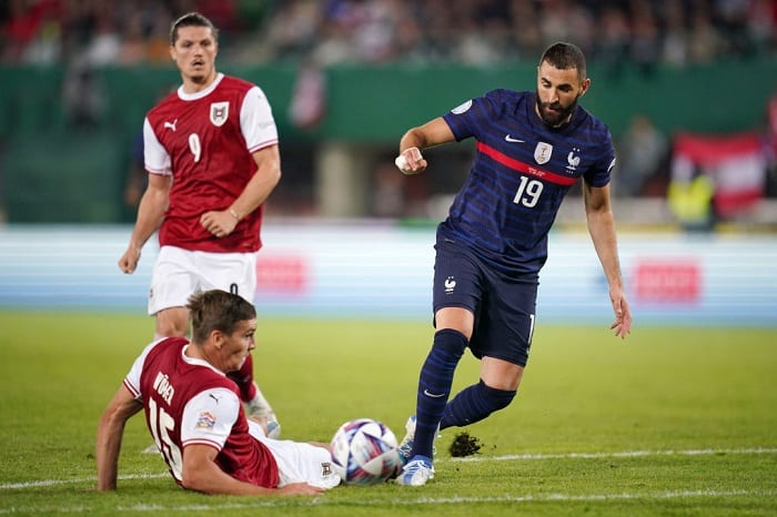 VIENNA, AUSTRIA - JUNE 10: Karim Benzema of France battles for possession with Maximilian Woeber of Austria during the UEFA Nations League - League A Group 1 match between Austria and France at Ernst Happel Stadion on June 10, 2022 in Vienna, Austria. (Photo by Christian Hofer/Getty Images)
