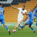 WOLVERHAMPTON, ENGLAND - JUNE 11: Harry Kane of England is challenged by Federico Dimarco of Italy during the UEFA Nations League - League A Group 3 match between England and Italy at Molineux on June 11, 2022 in Wolverhampton, England. This game will be played behind closed doors following on from the Euro 2020 final (Photo by Richard Heathcote/Getty Images)