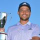 CROMWELL, CT - JUNE 26: Xander Schauffele holds the trophy on the 18th green after the final round of the Travelers Championship at TPC River Highlands on June 26, 2022 in Cromwell, Connecticut. (Photo by Ben Jared/PGA TOUR via Getty Images)