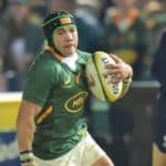 Wales' Rhys Carre (L) attempts to tackle South Africa's wing Cheslin Kolbe (C) during an international rugby union match between South Africa and Wales at Loftus Versfeld in Pretoria on July 2, 2022. (Photo by Christiaan KOTZE / AFP) (Photo by CHRISTIAAN KOTZE/AFP via Getty Images)