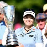 EVIAN-LES-BAINS, FRANCE - JULY 24: Brooke M. Henderson of Canada lift the trophy after winning the The Amundi Evian Championship during day four of The Amundi Evian Championship at Evian Resort Golf Club on July 24, 2022 in Evian-les-Bains, France. (Photo by Stuart Franklin/Getty Images)