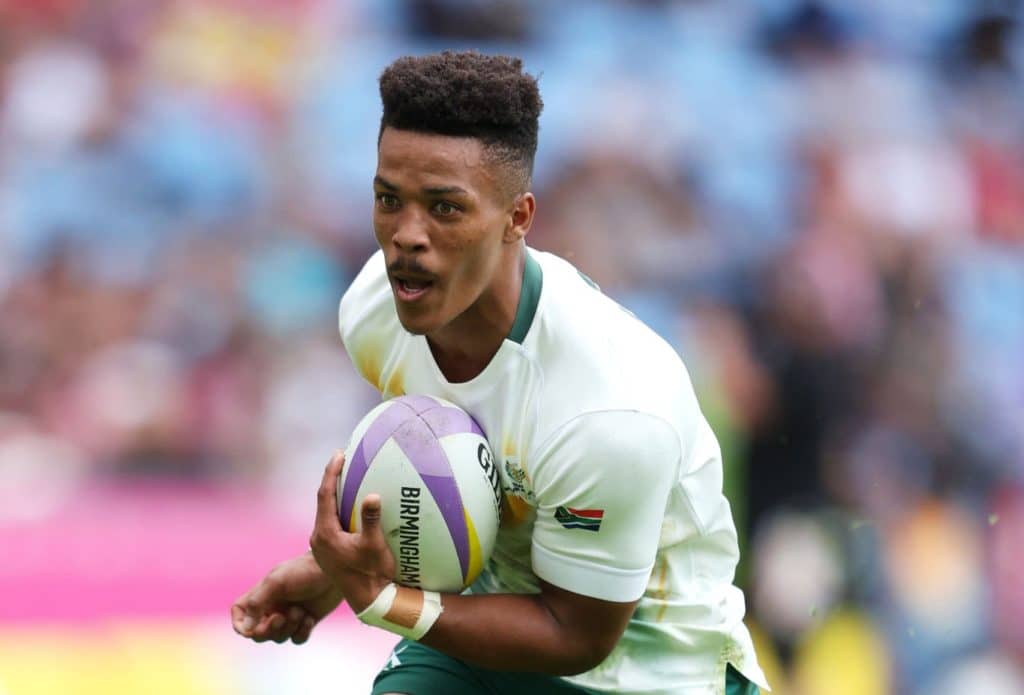 COVENTRY, ENGLAND - JULY 30: Angelo Davids of Team South Africa runs with the ball before going over to score a try during the Men's Pool B match between Team South Africa and Team Scotland on day two of the Birmingham 2022 Commonwealth Games at Coventry Stadium on July 30, 2022 on the Coventry, England. (Photo by Richard Heathcote/2022 Getty Images)