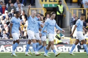 Read more about the article Watch: Man City cruise to top spot against 10-man Wolves